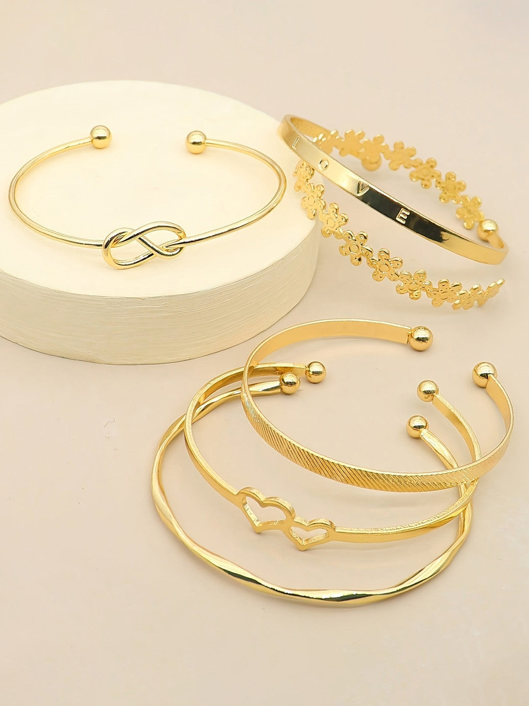 Stackable gold bangle set non‑tarnish cuff bracelets.